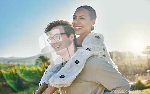 Image of Couple, interracial and love with adventure outdoor, piggyback and smile while on holiday with summer and sun. Relationship, commitment and care with man and black woman, happy with peace and travel.