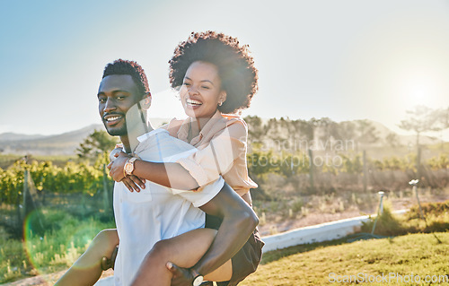 Image of Black couple, piggy back or bonding in park, nature garden or sustainability environment in fun activity game or love. Smile, happy man or afro woman in carry support, trust or freedom playful date