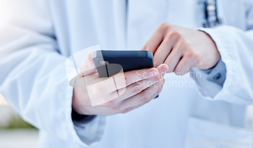 Image of Closeup, hands and doctor with smartphone, online reading or connection for typing. Zoom, medical professional or cellphone for social media, research or search internet for information or healthcare