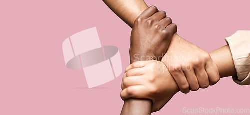 Image of People, diversity and hands together in teamwork collaboration for trust against a pink studio background. Diverse group of friends holding hand in unity, solidarity or community agreement on mockup