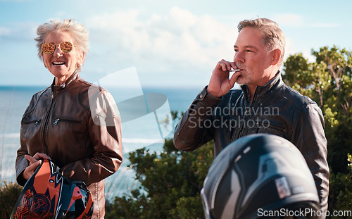 Image of Smoking, road trip and a senior biker couple outdoor together for an adventure ride during retirement. Smoke, travel or journey with a mature man and woman on the coast for a summer joyride