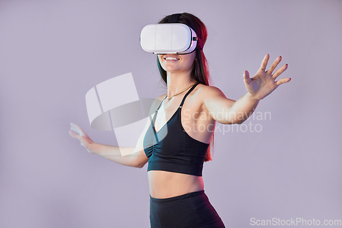 Image of Virtual reality, fitness metaverse and woman in studio isolated on a purple background. 3d gamer, vr smile and happy female athlete with futuristic headset for gaming, esports and fantasy simulation.