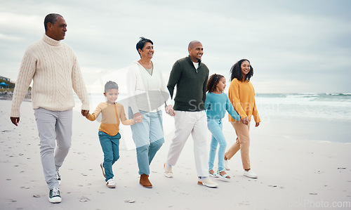 Image of Happy grandparents, parents and children on beach enjoying holiday, travel vacation and weekend together. Big family, relax and happy people holding hands for bonding, quality time and walking by sea