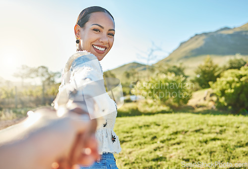 Image of Woman, park portrait and pov for holding hands, romance and love on nature adventure in sunshine. Girl, summer and outdoor in countryside with smile, happy and bonding by trees, grass and mountain