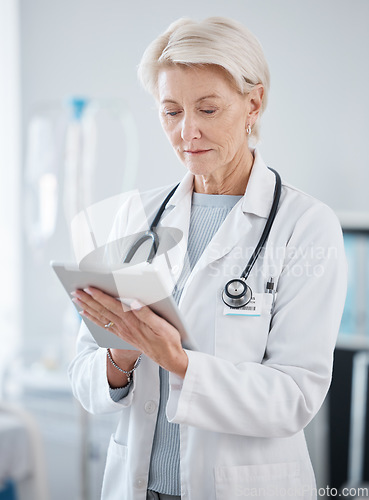 Image of Healthcare, research and senior doctor with tablet for online consulting, telehealth and wellness app. Cardiology, hospital and woman on digital tech for internet, medical results and patient data