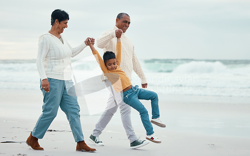 Image of Family, beach and grandparents play with child enjoying holiday, vacation and weekend together. Retirement, travel and happy grandfather, grandma and boy for bonding, quality time and love by sea