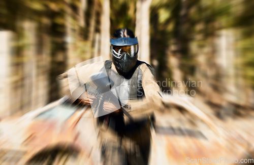 Image of Soldier, paintball and running with gun for intense battle or war in the forest pushing to attack. Active paintballer rushing or moving fast in extreme adrenaline sport for solo, weapon or camouflage