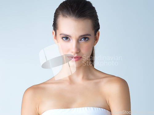 Image of Beauty, skincare and smile, portrait of woman in studio isolated on blue background for salon cosmetics or makeup. Face of beautiful model from Canada, spa facial and treatment for fresh, clean skin.