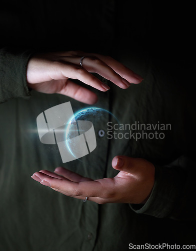 Image of Hand, world and hologram overlay with a user of ai or 3d technology accessing the metaverse for global networking. Globe, software and holographic with a person using a ux interface or dashboard