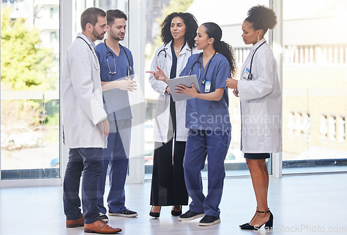 Image of Doctors, diversity team and discussion in clinic for surgery planning, agenda report and medical schedule. Healthcare group, hospital employees and paperwork for expert help, results or collaboration