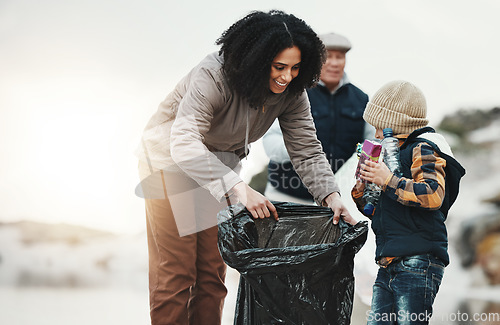 Image of Beach cleaning, plastic and family with child volunteer for education, learning and community support. Happy people, mother and kid help with plastic waste, garbage or trash in climate change project