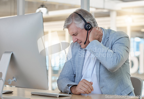 Image of Call center, customer service and neck pain with a consultant man suffering from tension while working in the office. Crm, support and burnout with a senior male telemarketing working feeling stress