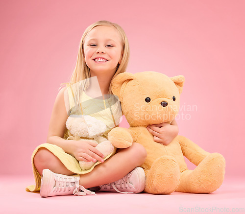Image of Teddy bears, girl and portrait with soft toys with happiness and love for playing in a studio. Isolated, pink background and a young female child feeling happy, joy and cheerful with stuffed friend