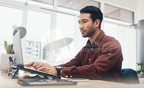 Image of Business man, laptop and information technology, tech support and serious while working in office. Typing, glitch or 404 with software update, corporate male at desk with digital problem solving