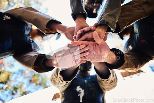 Image of Goals, paintball team or hands in huddle for strategy, hope or soldier training on war battlefield. Mission, low angle or army people planning with support in partnership or military group solidarity