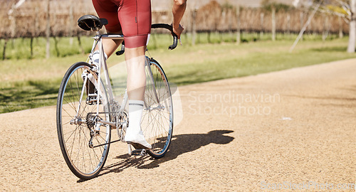 Image of Back of man, bicycle and path in park, exercise and training of triathlon sports in sunshine. Cyclist legs, bike and outdoor cycling trail for freedom, cardio fitness adventure and performance mockup