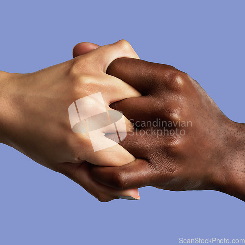 Image of Hands, partnership and different with a collaboration of people in studio on a blue background for support. Fingers, linked and grip with friends joined together in unity, diversity or solidarity