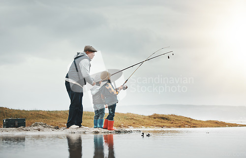 Image of Lake, outdoor and grandfather fishing with children while on a adventure, holiday or weekend trip. Hobby, travel and elderly man teaching kids to catch fish in nature while on vacation in countryside