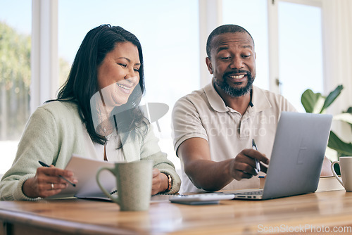 Image of Budget, laptop and interracial couple planning home finance, savings or mortgage and taxes together in the living room. Couch, sofa and people review financial insurance document or paperwork