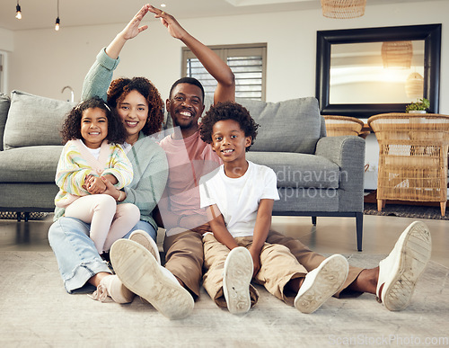 Image of Family, portrait and protection, love and insurance for security with parents and children. Hands together, roof and happy people in living room, unity and safety for life and home cover with smile