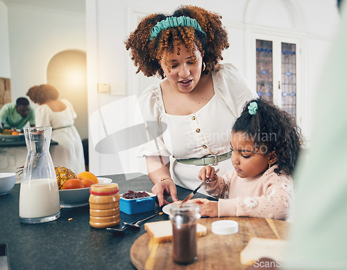 Image of Love, breakfast food and black family kid, mother or people eating meal, bonding and prepare ingredients. Morning cooking, kitchen counter or hungry mom with young child making peanut butter sandwich