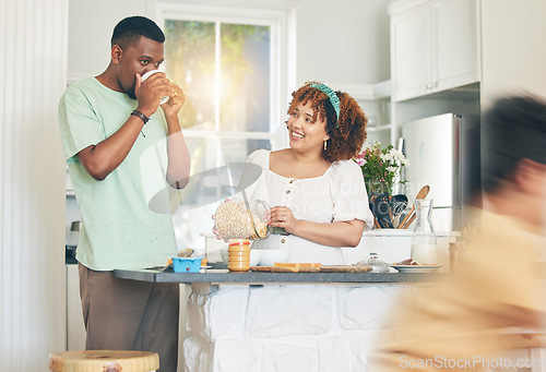Image of Love, coffee and couple in the kitchen for breakfast together in their modern family home. Happiness, smile and young man drinking a cappucino while bonding and cooking with his wife at their house.