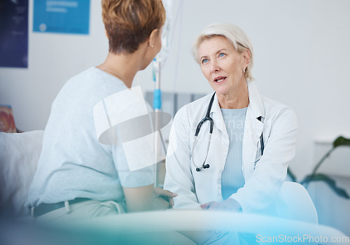 Image of Woman, doctor and talking to patient for healthcare, clinic services and advice of wellness, therapy and results. Medical worker helping with serious hospital support, gynecology consultation or test