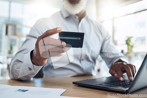 Image of Man, business credit card and hands on laptop for ecommerce, finance or accounting in office. Closeup worker, computer and financial payment of budget, fintech trading or digital online economy