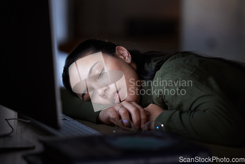 Image of Tired, night and a business woman sleeping at her desk while working overtime in her office. Burnout, deadline and exhausted with a female employee asleep in the workplace during the late shift