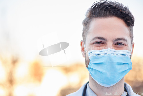 Image of Covid face mask, doctor and man portrait outdoor with space for medical and health mockup. A happy healthcare worker with ppe for corona virus safety, policy and compliance for wellness and help