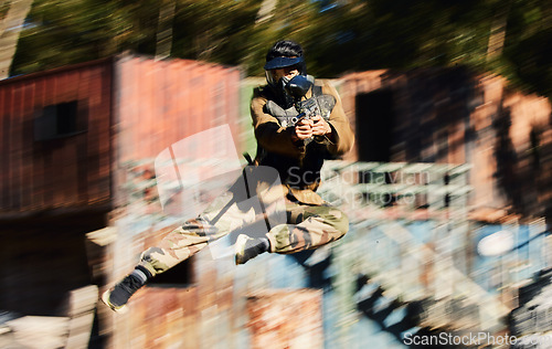 Image of Blurred, military and man shooting in paintball, army training and fitness test for war. Sports, game and soldier jumping with a gun for battle on a battlefield, playing and competing in games