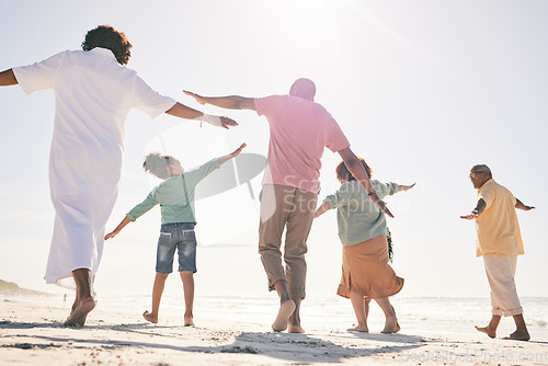 Image of Family on beach, freedom and generations on vacation with fun and grandparents, parents and kids. Travel, people outdoor and carefree, excited running and playful, happiness on adventure back view