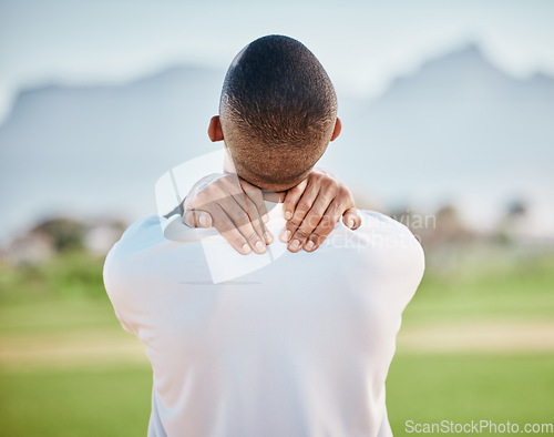 Image of Neck pain, injury and athlete hurt on sports field at training, fitness and exercise suffering from muscle inflammation. Workout, physical and back view of man in an emergency due to accident