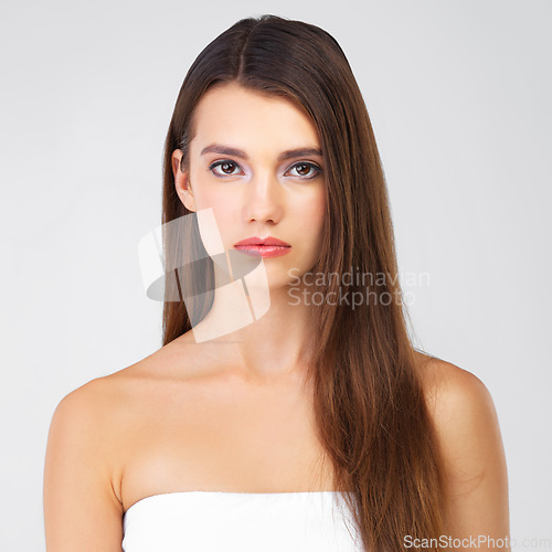 Image of Beauty, skincare and hair, portrait of woman in studio isolated on white background salon cosmetics. Serious face of beautiful model from Portugal, spa facial and treatment for fresh, clean skin glow