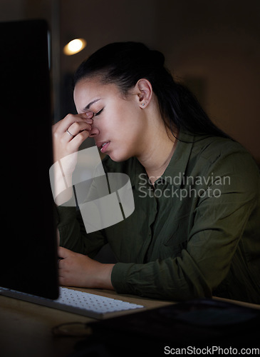 Image of Computer, headache and stress by woman in office suffering from burnout, depressed and overworked. Dark, evening and corporate professional person frustrated, overtime and sick or sad employee