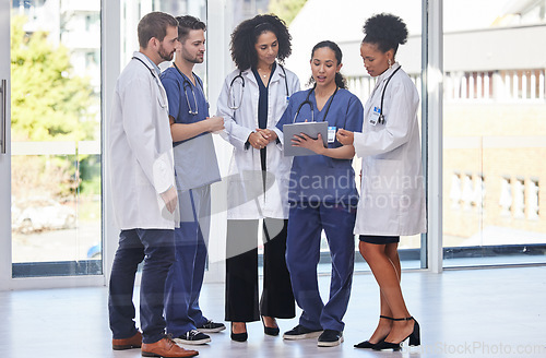 Image of Healthcare, meeting and digital tablet for doctors and nurses planning surgery, research or problem solving in a hospital. Strategy, online and schedule for medical experts sharing ideas for solution