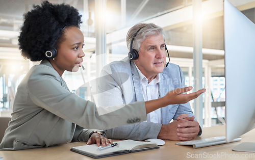 Image of Call center, teamwork and coaching, black woman with man at computer at help desk office. Customer service consultant manager, support and training at advisory agency with diversity and trust in team