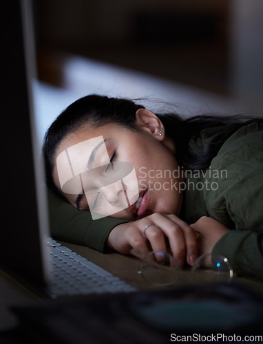 Image of Exhausted, night and a business woman sleeping at her desk while working overtime in her office. Burnout, deadline and tired with a female employee asleep in the workplace during the late shift