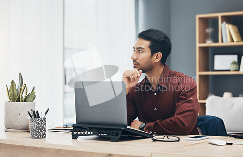 Image of Thinking, laptop and business man in office contemplating, planning or decision making. Idea, thoughts and pensive professional, problem solving or looking for solution to work project in workplace.