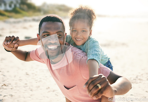 Image of Black family, beach and a piggyback daughter with her father outdoor in nature together during summer. Portrait, smile or fun with a happy dad and girl child bonding on the sand by the ocean or sea