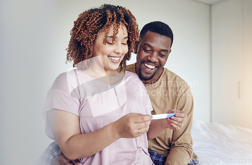 Image of Couple with pregnancy test results, fertility and people having a baby, happy with love and care at home. Interracial, black man and pregnant woman, start family with new mother and father with smile