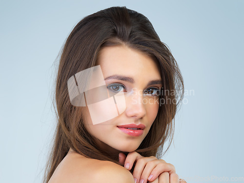 Image of Makeup, beauty and portrait of woman with smile on blue background for wellness, skincare and spa treatment. Salon aesthetic, dermatology and face of happy girl with cosmetics, hair care and facial