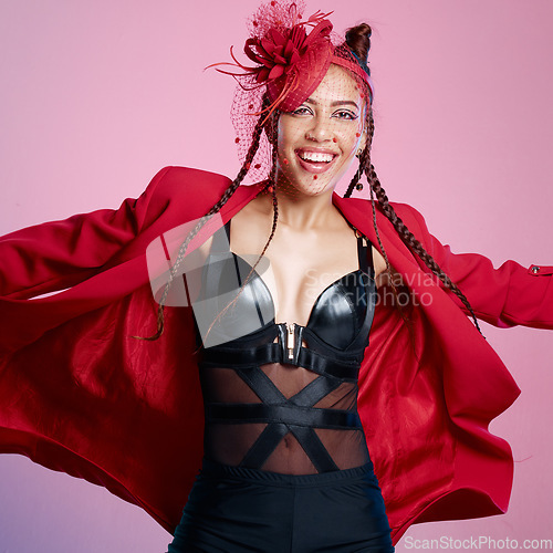 Image of Punk, rock and portrait of a woman smile with creative designer, fashion and leather clothing. Isolated, pink background and gen z latino model beauty with cool, rocker and funky style in a studio