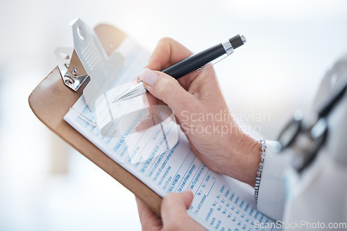 Image of Woman, doctor hands and writing on clipboard, checklist and healthcare consulting information. Closeup medical worker write documents, data and questions for report, planning or clinic administration