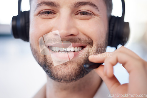 Image of Man at call center, face and contact us with customer support employee, smile and CRM with consultant closeup. Professional, portrait and communication, male with headset, help desk and telemarketing