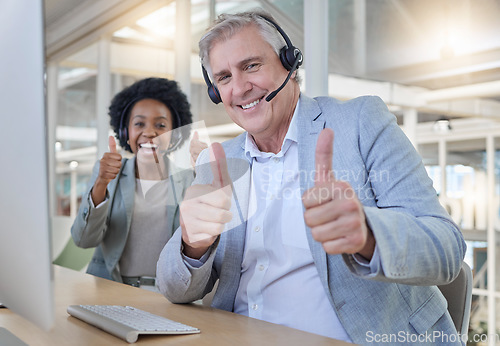 Image of Customer support, thumbs up and portrait of happy employees with headset in consulting office. Help desk, smile and mature man with black woman at advisory agency for networking online at call center