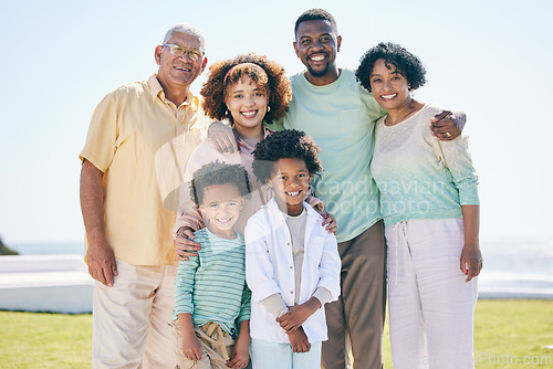 Image of Love, smile and portrait of a happy family at a beach for travel, vacation and holiday on nature background. Relax, face and trip with children, parents and grandparents bond while traveling in Miami