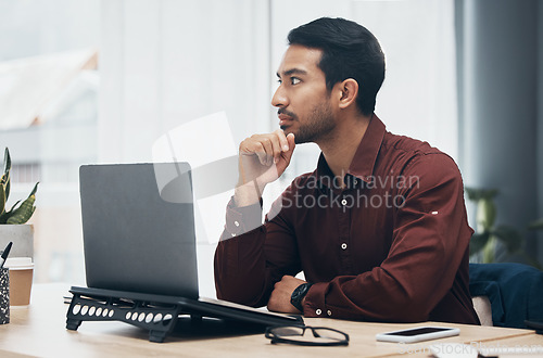 Image of Laptop, thinking and business man in office contemplating, planning or decision making. Idea, thoughts and pensive professional, problem solving or looking for solution to work project in workplace.
