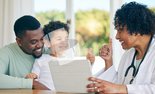 Image of Pediatrician, father and child with thumbs up from patient results on a tablet with good news. Happy kid, dad and doctor in a clinic consultation office with a healthcare worker and smile in hospital