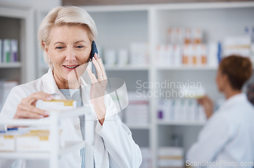 Image of Pharmacy medicine, pharmacist phone call and woman talking in drugstore for telehealth. Healthcare, smartphone and happy senior medical doctor in consultation for medication prescription in shop.